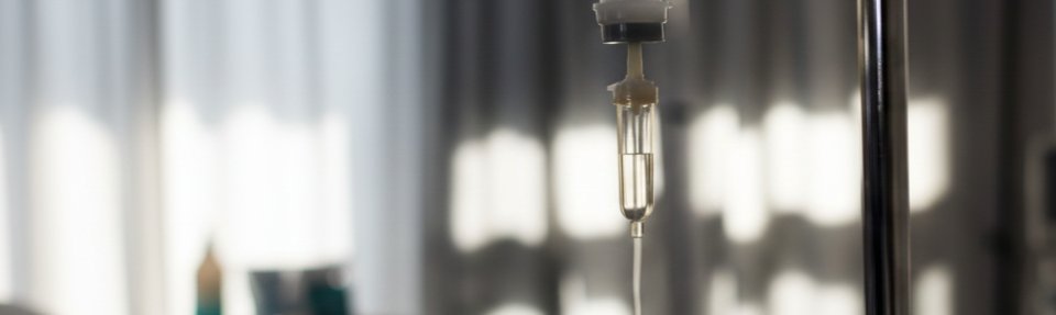 Drip chamber portraying IV infusion therapy.